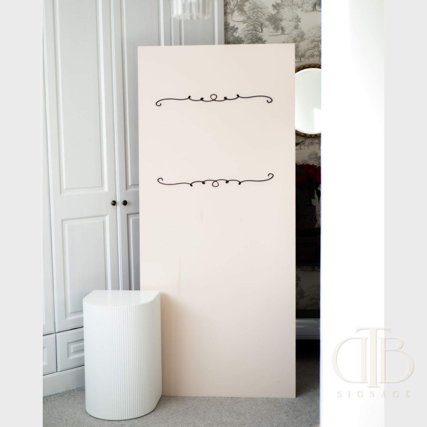 White standing mirror with decorative elements in a room setting