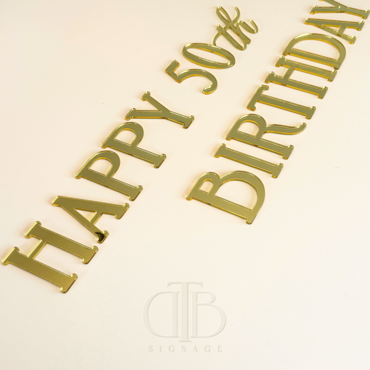 Example signages from The Milestone Kit, showing the text HAPPY 50th BIRTHDAY.