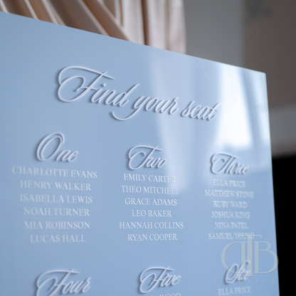 Light blue seating chart with names on a blurred background