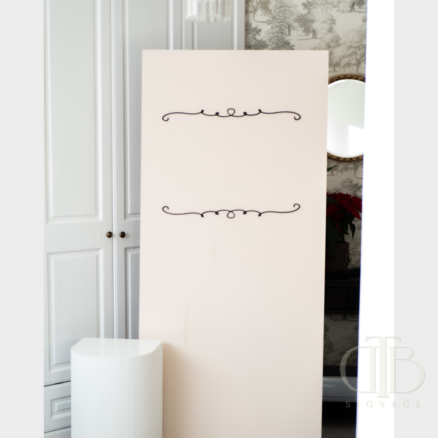 White standing mirror with decorative elements in a room setting