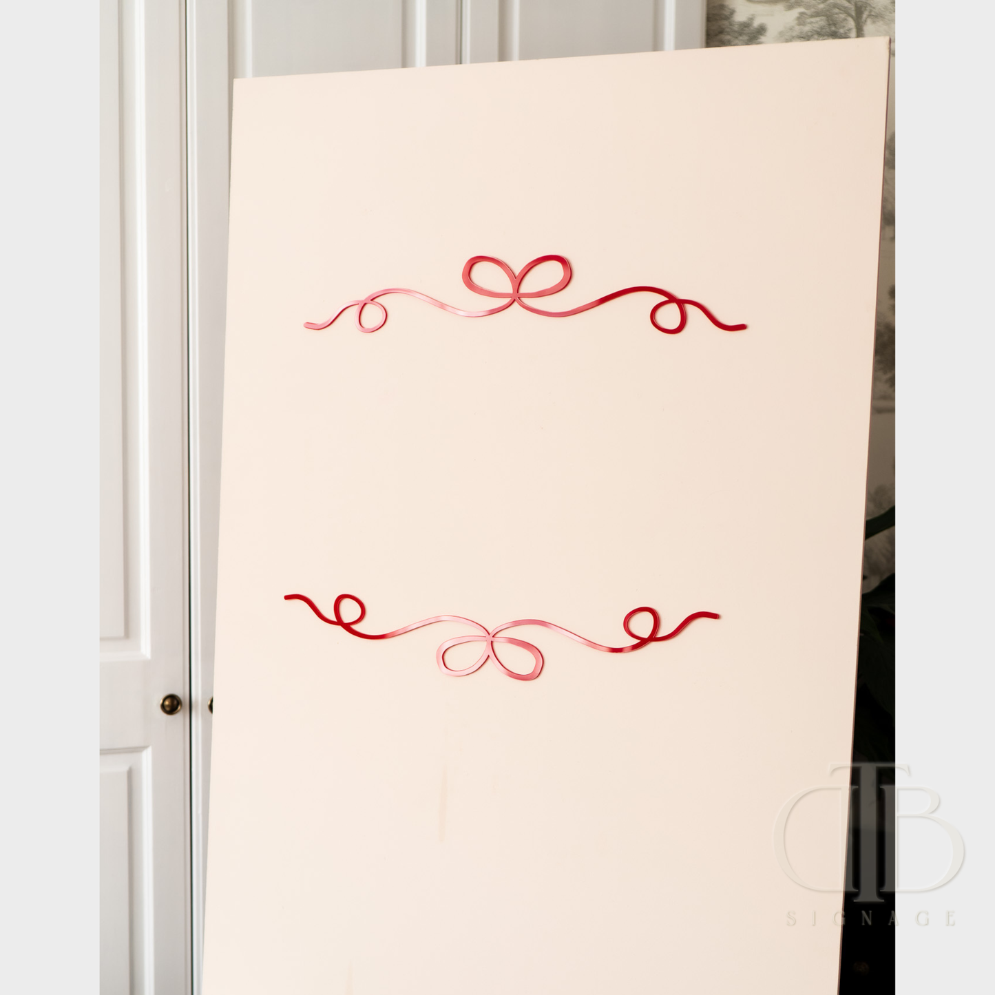 White board with red decorative elements on a white wall