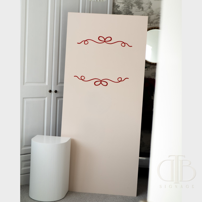 White decorative panel with red embellishments in a room setting