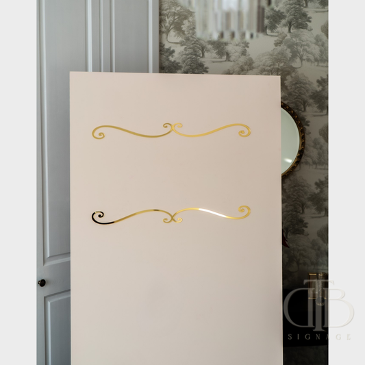 Beige placemat with gold decorative elements on a table setting.