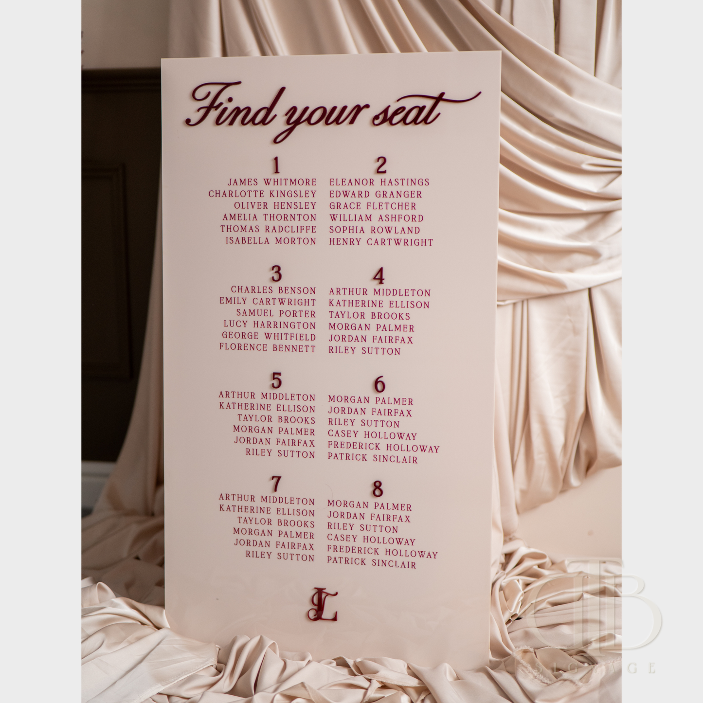 Seating chart for an event with names and numbers on a pink background