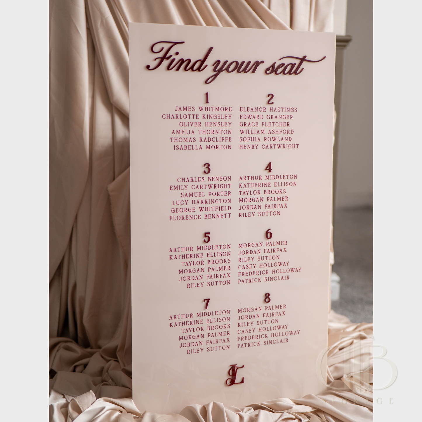Seating chart for a formal event with names listed on a light pink background.