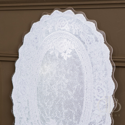 Set of white lace doilies acrylic signage  on a brown background