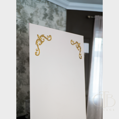 White card with gold decorative elements on a blurred background