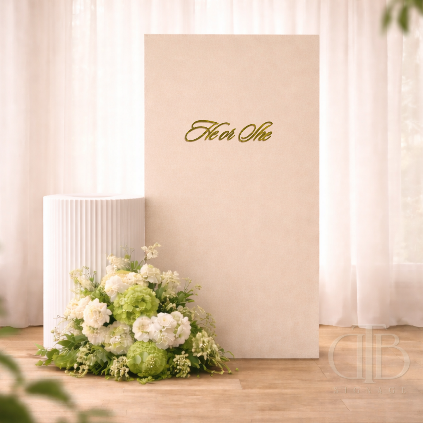 Floral arrangement in front of a neutral backdrop with 'He or She' text.