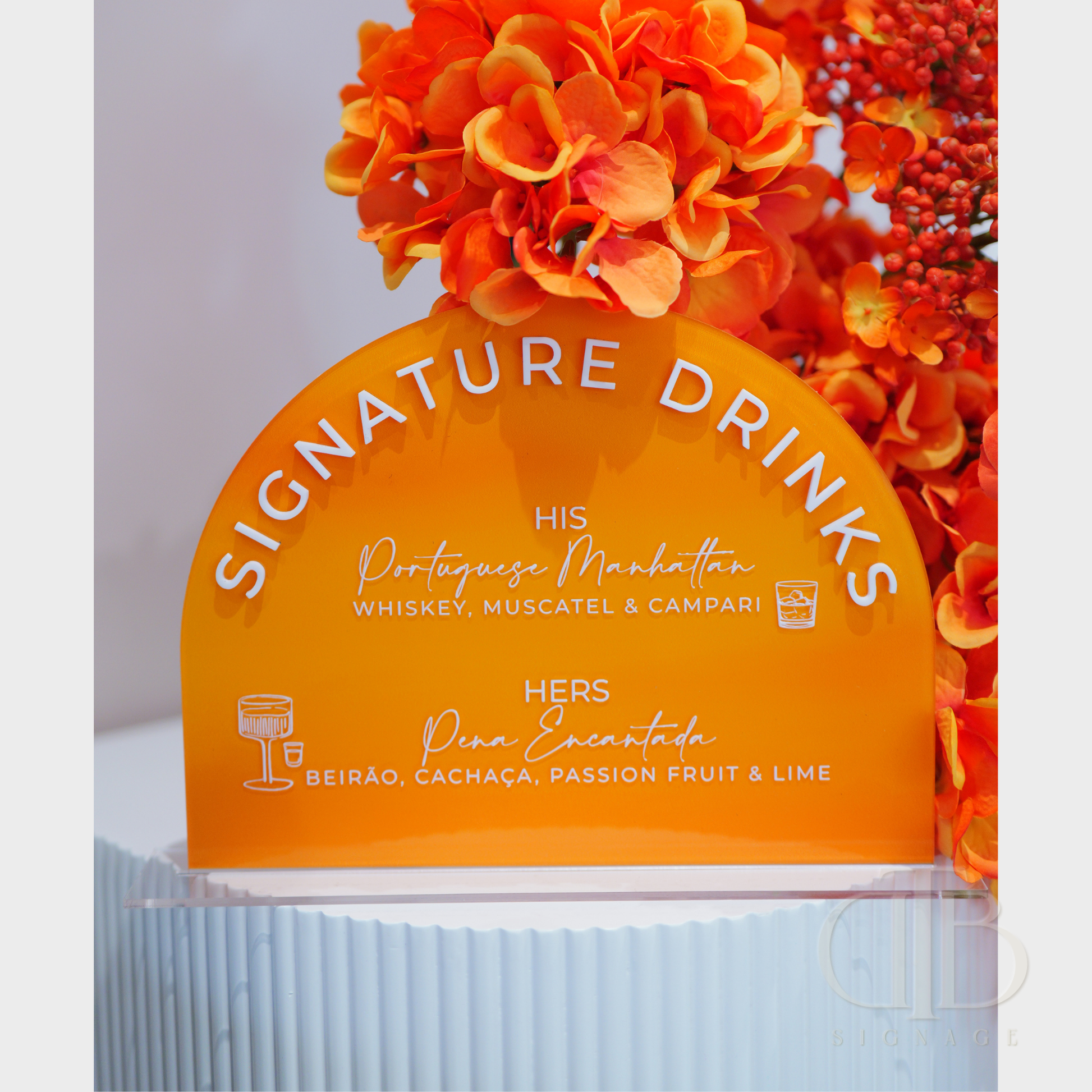 Orange sign with cocktail recipes and floral decorations on a white background