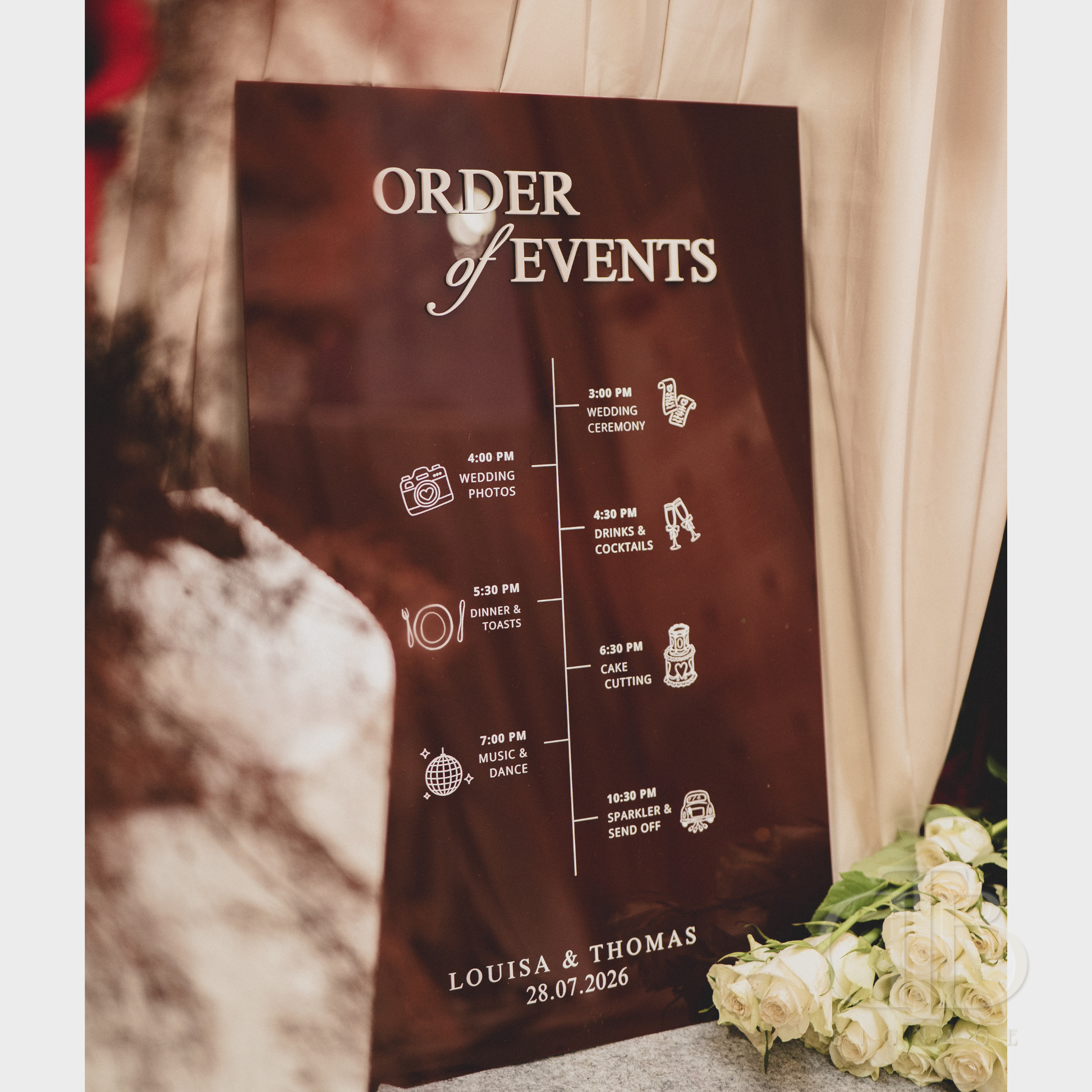 Order of Events sign for a wedding with a brown background and white text.