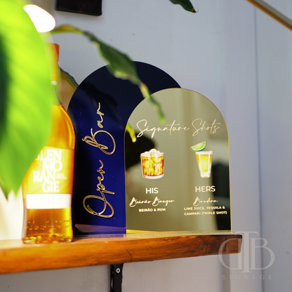 Bottle of Jose Cuervo and a decorative sign for 'Open Bar' on a shelf.