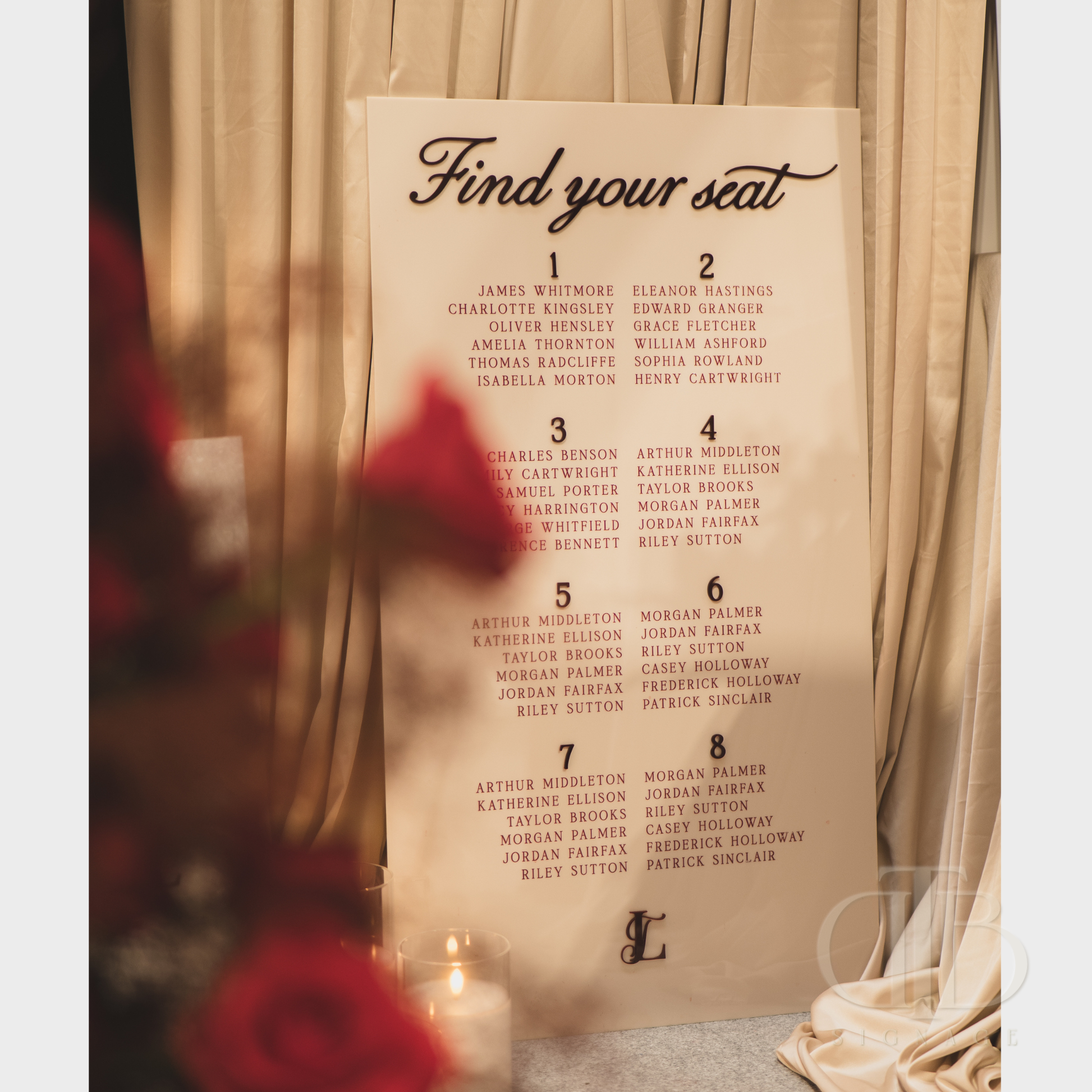 Seating chart for an event with names against a curtain backdrop