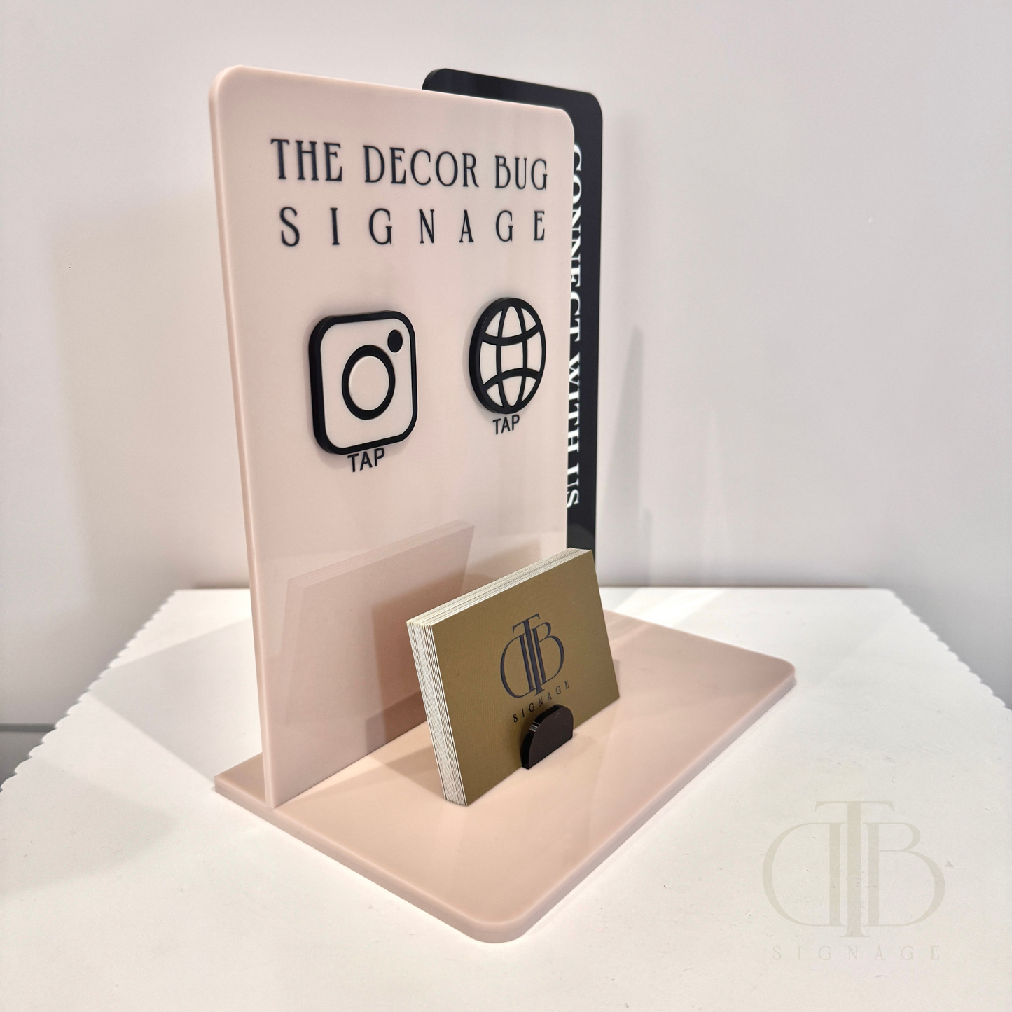 Left side view of Customisable acrylic Social Media Board with Whatsapp and Instagram icons with NFC tap technology on a white surface, also have a slot of holding Business Cards, fully made of premium acrylics. 