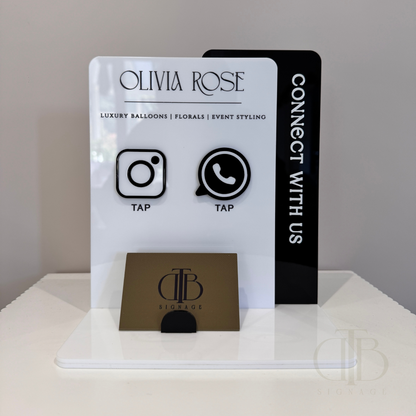 Customisable Social Media Board with Whatsapp and Instagram icons with NFC tap technology on a white surface, also have a slot of holding Business Cards, fully made of premium acrylics. 