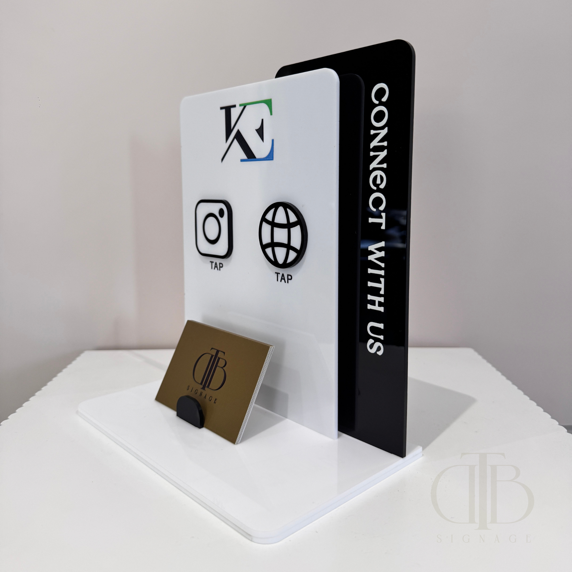 Side view angle of Customisable Social Media Board with Wesbite and Instagram icons with NFC tap technology on a white surface, also have a slot of holding Business Cards, fully made of premium acrylics. 