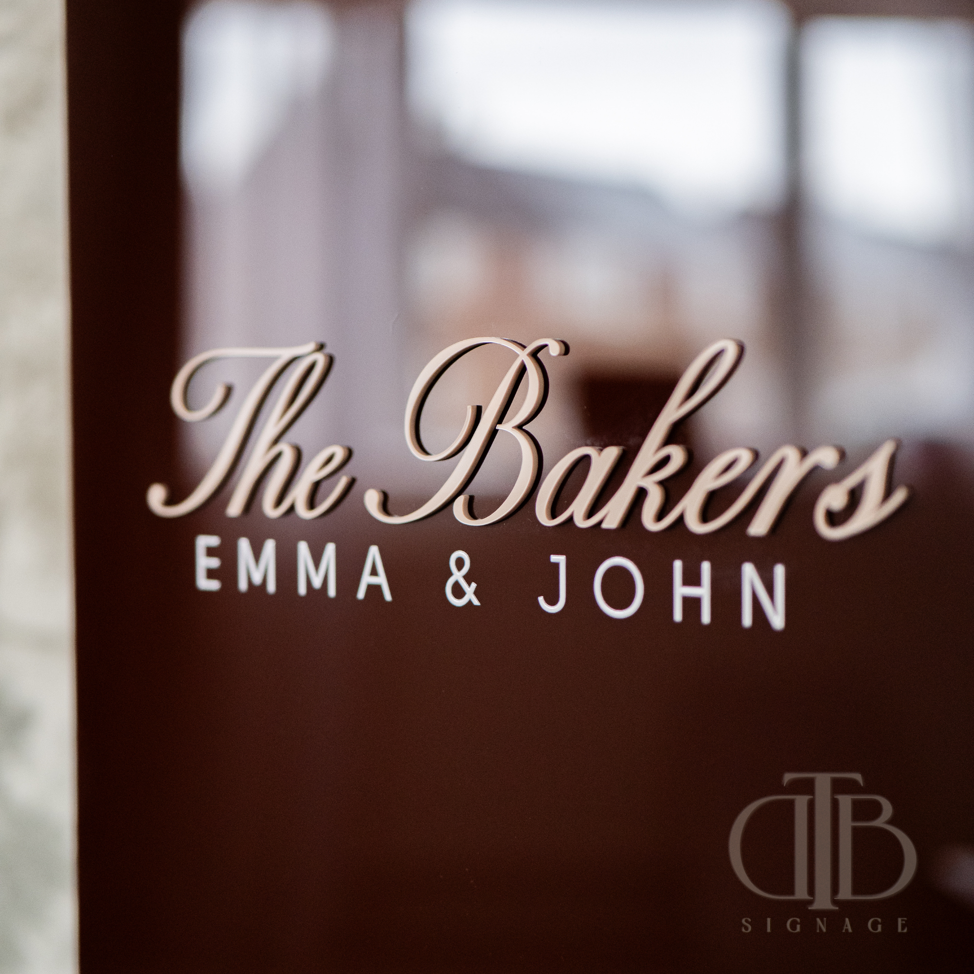 Decorative glass with 'The Bakers EMMA & JOHN' text and 'DTB SIGNAGE' logo.
