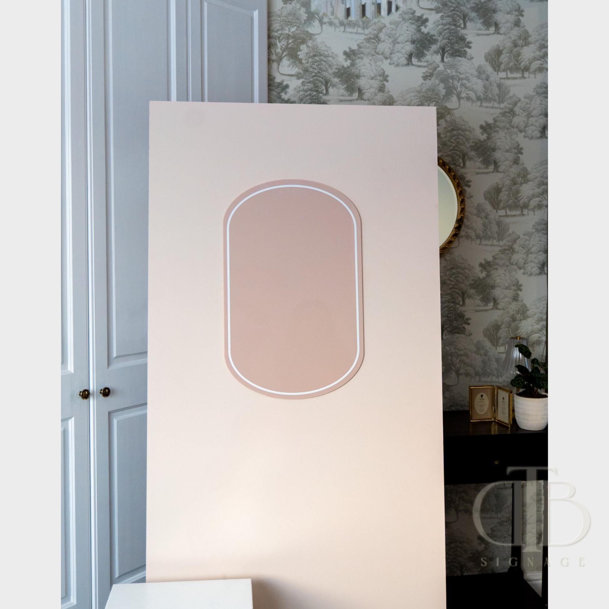 Decorative wall acrylic signage with a floral pattern on a wall