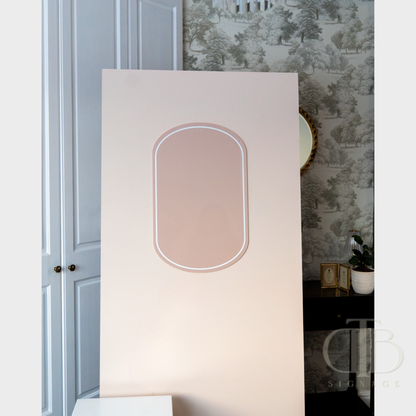 Decorative wall acrylic signage with a floral pattern on a wall