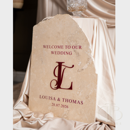 Wedding welcome sign with personalized details on a draped fabric background